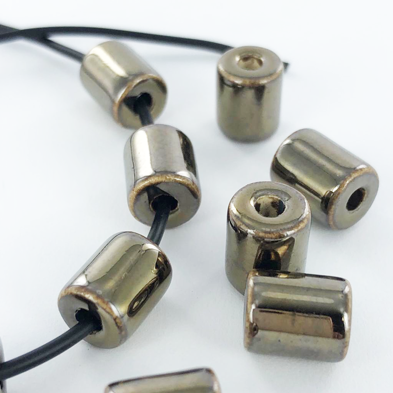 Keramiek porselein kralen cilinder 10mm brons per 3 stuks