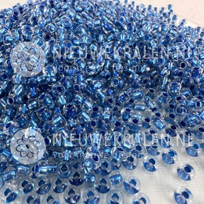 Preciosa rocailles 6/0 Crystal Colour Lined Blue (68236) – transparante Tsjechische seed beads van ca. 4 mm met blauwe kern/lining