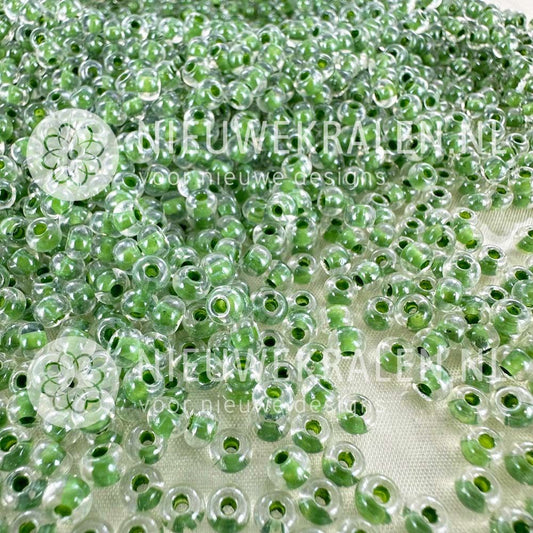 Preciosa rocailles 6/0 Crystal Colour Lined Green (38657) – transparante Tsjechische seed beads van ca. 4 mm met groene kern/lining