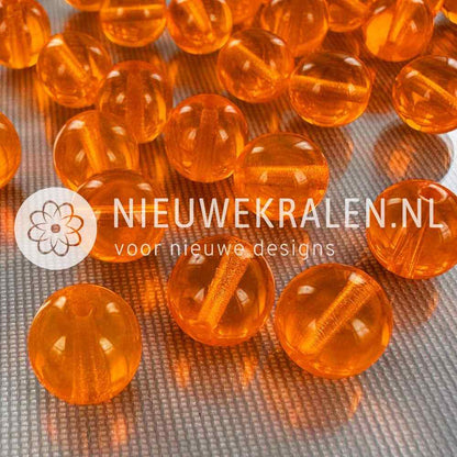 Tsjechische glaskralen rond 10mm oranje transparant – pressed beads Boheems glas