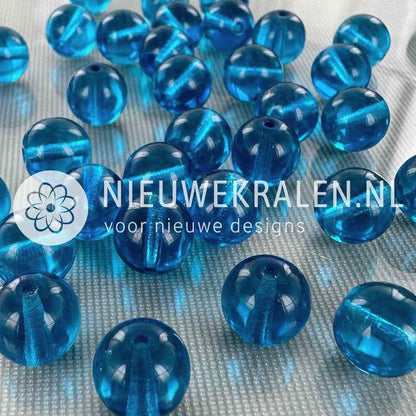 Tsjechische glaskralen rond 10mm transparant blauw – pressed beads Boheems glas