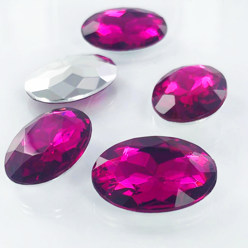 Fancy stones facet ovaal kunststof 25mm x 18mm fuchsia Nieuwekralen