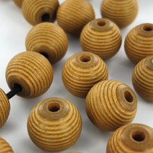 Afbeelding in Gallery-weergave laden, Houten kralen rond geribbeld 12mm mat bruin per 20 stuks
