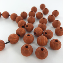 Afbeelding in Gallery-weergave laden, Houten kralen rond geribbeld 12mm mat bruin per 20 stuks
