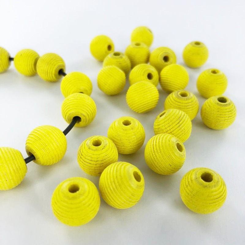 Houten kralen rond geribbeld 12mm mat geel per 20 stuks