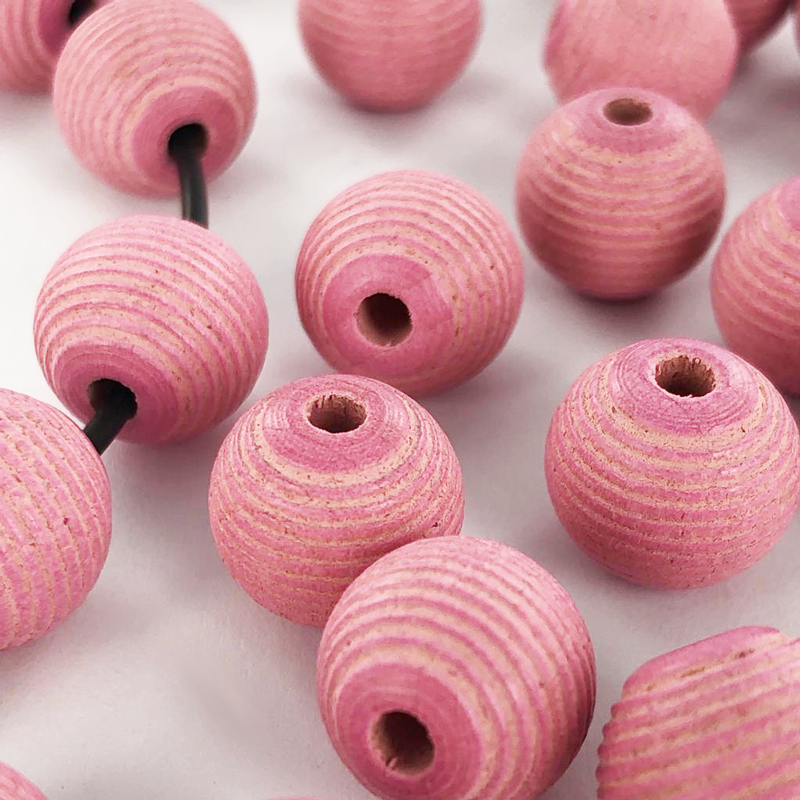 Houten kralen rond geribbeld 12mm mat roze per 20 stuks