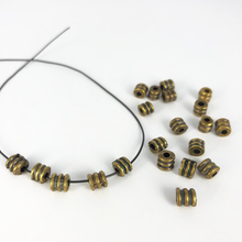 Afbeelding in Gallery-weergave laden, Metalen kralen spacer beads cilinder 5mm antiek goud per stuk
