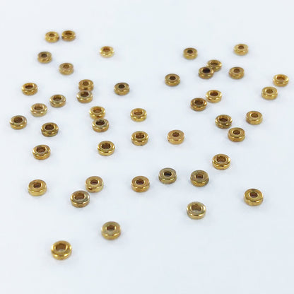 Metalen ringetjes platte kraal spacer bead 2mm verguld per 5 stuks