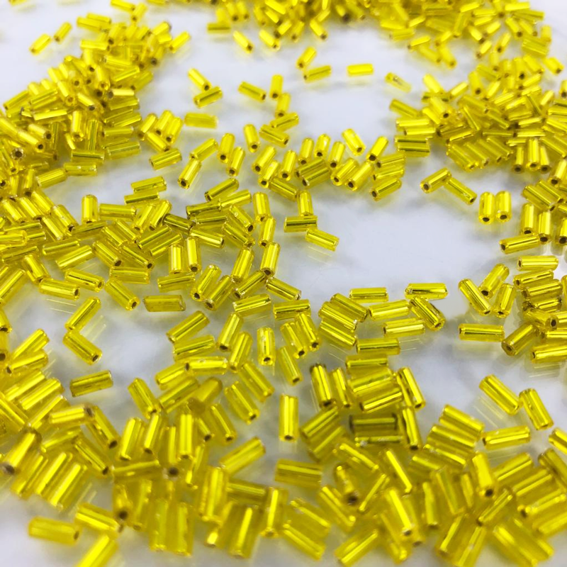 Staafjes kralen bugle beads 5mm geel