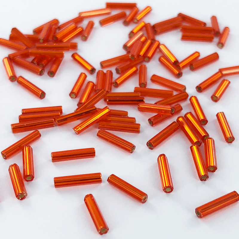 Staafjes kralen bugle beads 9mm oranje