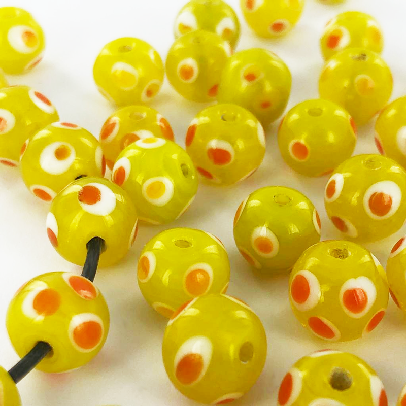 Glaskralen rond 10mm geel kralen met stippen wit oranje per 5 stuks