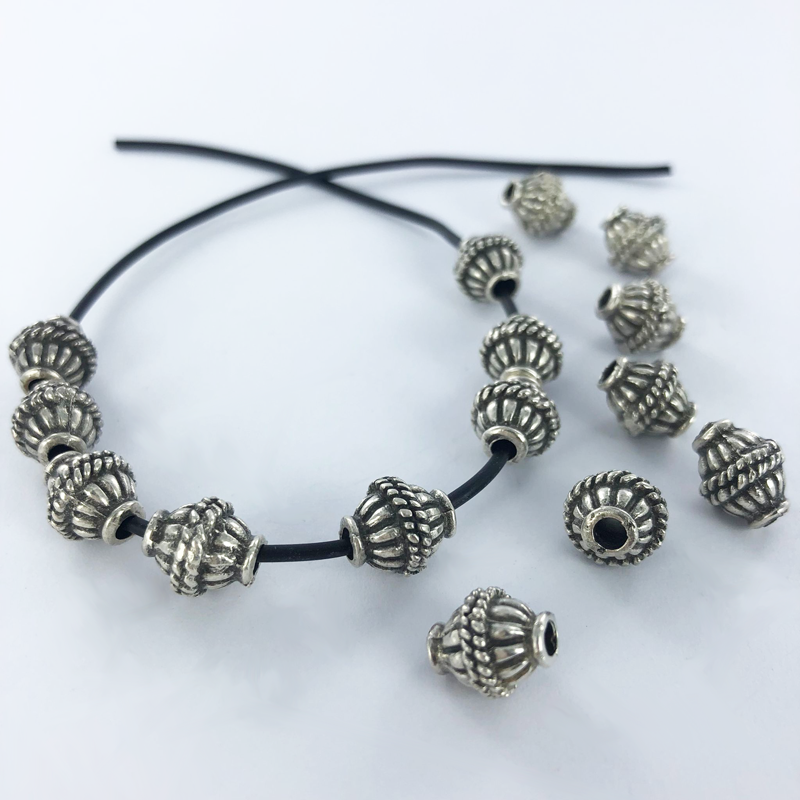 Metalen kralen spacer beads 10mm ovaal verzilverd antiek zilver per stuk
